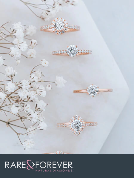 Rare & Forever Jewelry - image of 5 rose gold and diamond wedding rings with a floral background