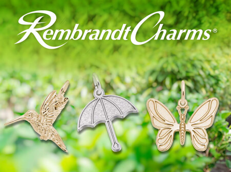 Rembrandt Charms - image of 3 Rembrandt Jewelry charms, 1 gold hummingbird, 1 silver umbrella, and 1 butterfly charm