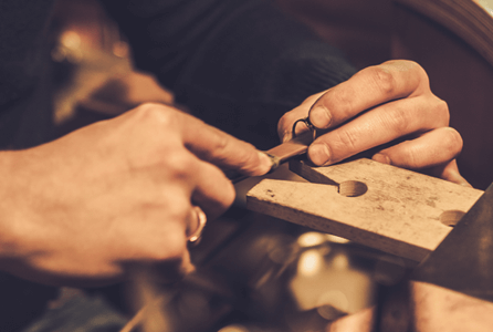 image of isolated hands repairing jewelry
